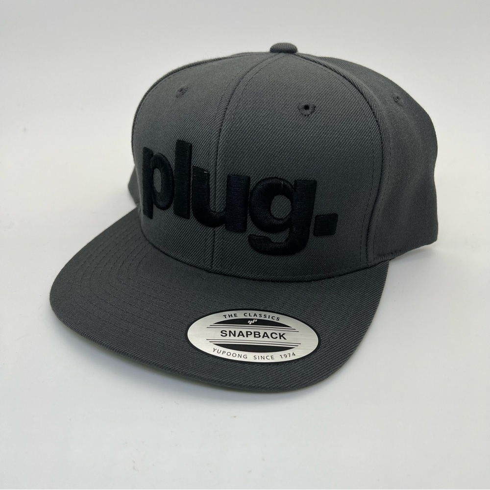 Plug Dark Grey with Black Lettering SnapBack Yupoong Hat New